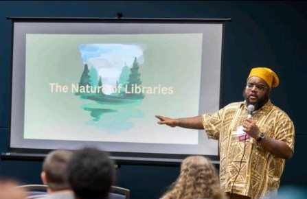 Christopher A. Fleming, MLIS speaking on library systems and persuasion